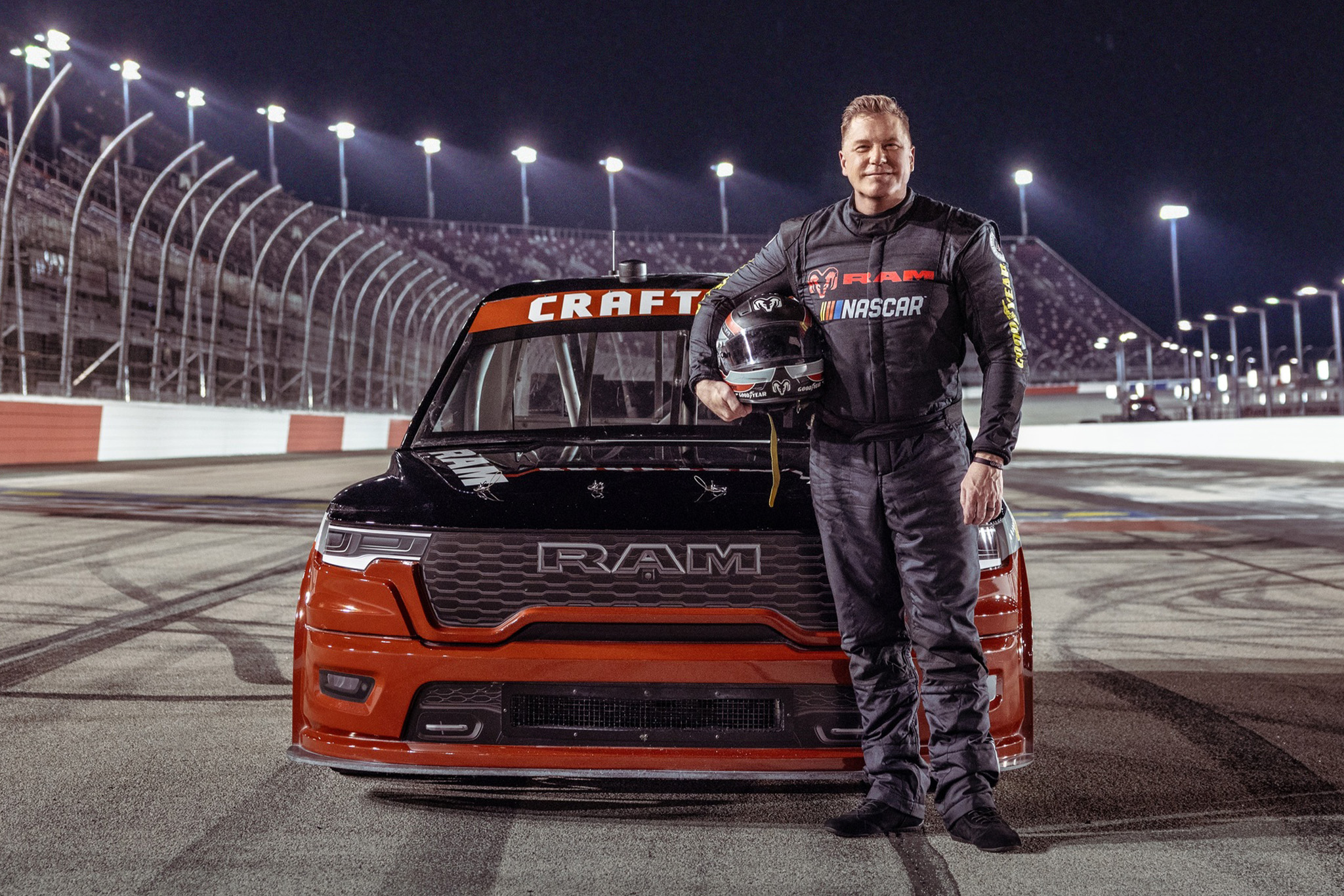 Ram CEO Tim Kuniskis stands in front of the Ram 1500 NASCAR Concept.