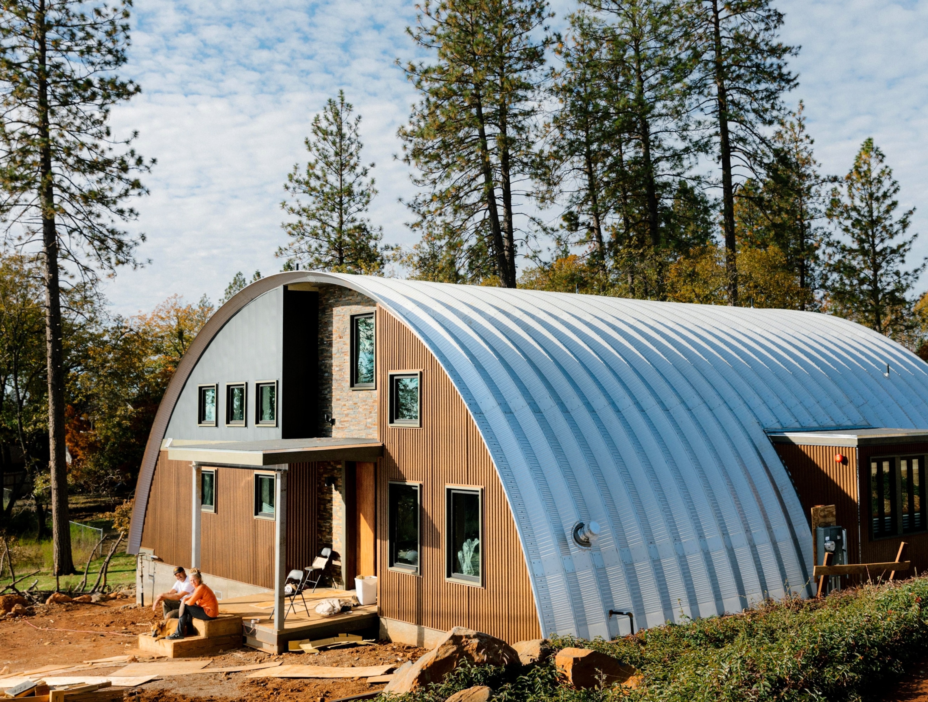 House in a shape of half-cylinder build of corrugated metal.