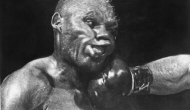 PHILADELPHIA - SEPTEMBER 23: Boxer "Jersey Joe Walcott" takes a hard punch from Rocky Marciano during their World Heavyweight Title fight on September 23, 1952 in Philadelphia, Pennsylvania. After Walcott dropped Marciano in the first round, Marciano held out and defeated Walcott in the 13th with a knockout punch that has been called the "greatest punch in boxing history". Born Arnold Raymond Cream in New Jersey, he was often compared to welterweight boxer Joe Walcott; thus he became known by the nickname "Jersey Joe Walcott". (Photo by Herb Scharfman/Sports Imagery/Getty Images)