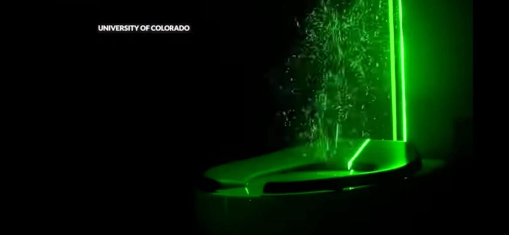 Visualization of aerosol dispersion from a toilet flush using green laser.