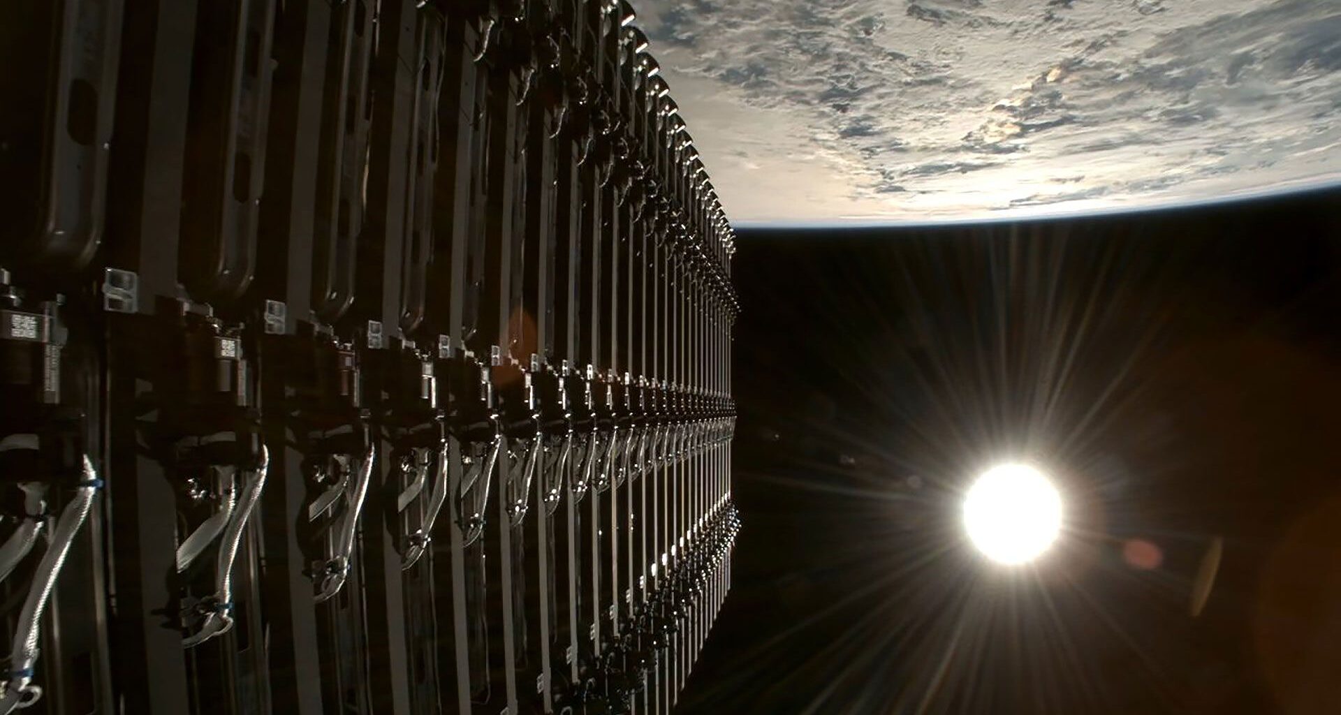 a stack of satellites are deployed into Earth orbit with the full sun visible