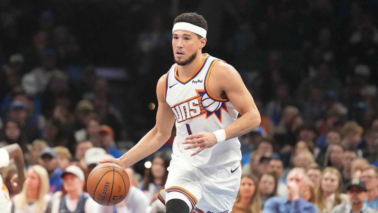Suns guard Devin Booker to miss at least a week with sprained ankle