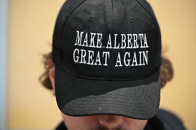 SHERWOOD PARK, CANADA  MARCH 18: 
A member of the public wears the 'Make Alberta Great Again' hat during the event Help Us Make Sovereignty for Alberta Happen, organized by the Alberta Prosperity Project in Sherwood Park, Strathcona County, Alberta, Canada, on March 16, 2025. (Photo by Artur Widak/NurPhoto via Getty Images)