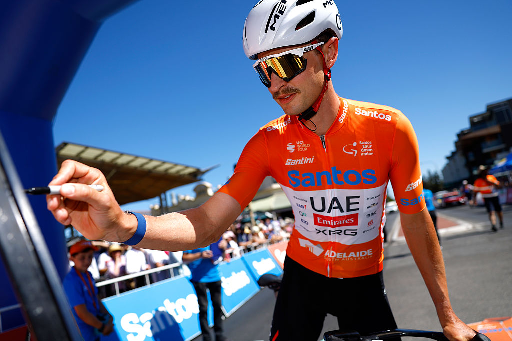 HENLEY BEACH, AUSTRALIA - JANUARY 23: Jay Vine of Australia and UAE Team Emirates - Orange Santos Leader&amp;apos;s Jerseyprior to the 26th Santos Tour Down Under 2026, Stage 3 a 140.8km stage from Henley Beach to Nairne / #UCIWT / on January 23, 2026 in Henley Beach, Australia. (Photo by Con Chronis/Getty Images)