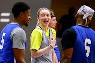 Dallas Wings guard Paige Bueckers (5) laughs with practice team players during a practice at...