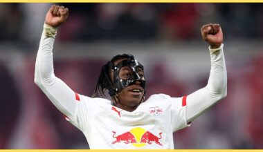 Yan Diomande pumps his arms in the air in celebration.