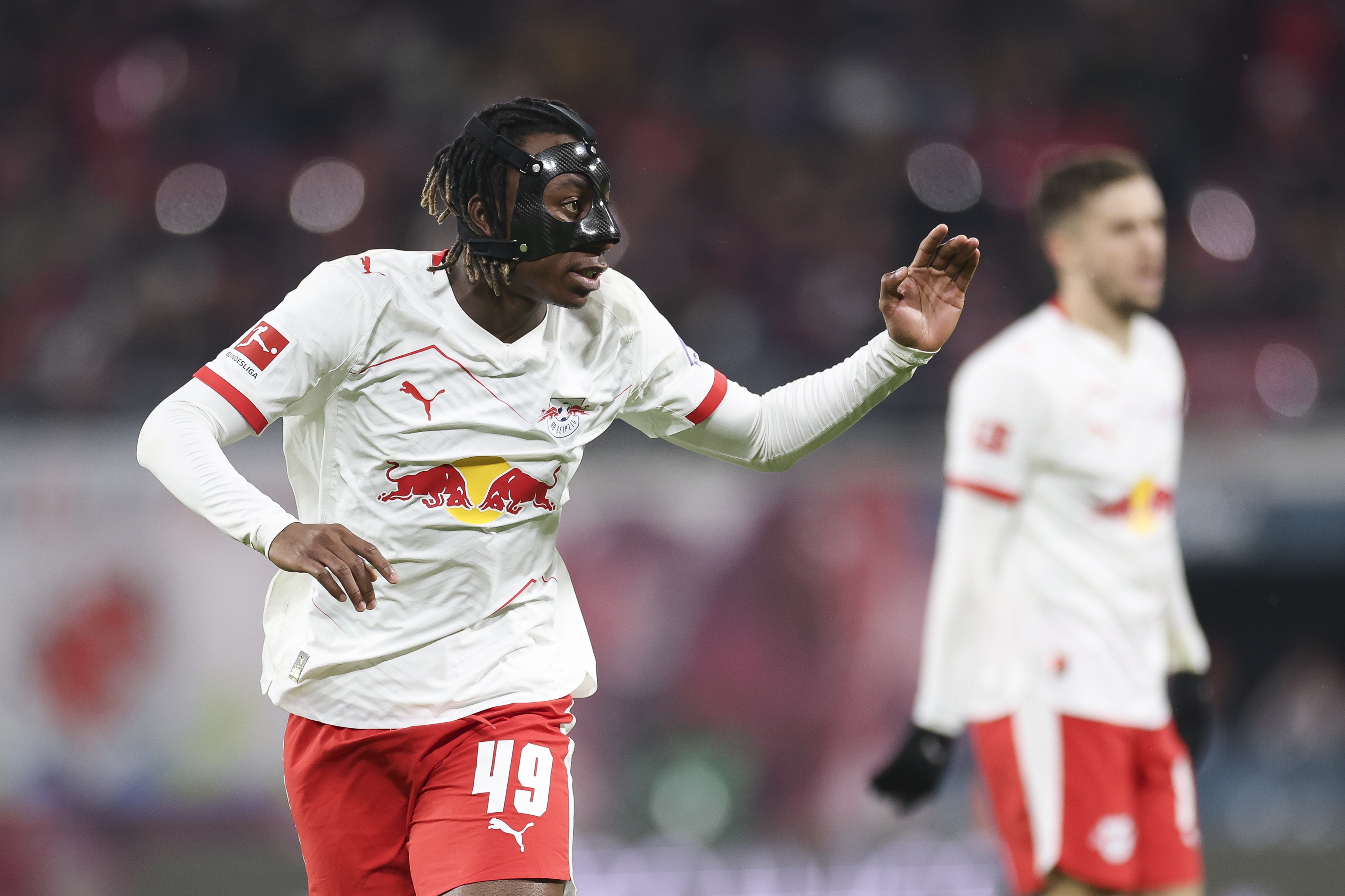 Yan Diomande holds up a hand during Leipzig game.