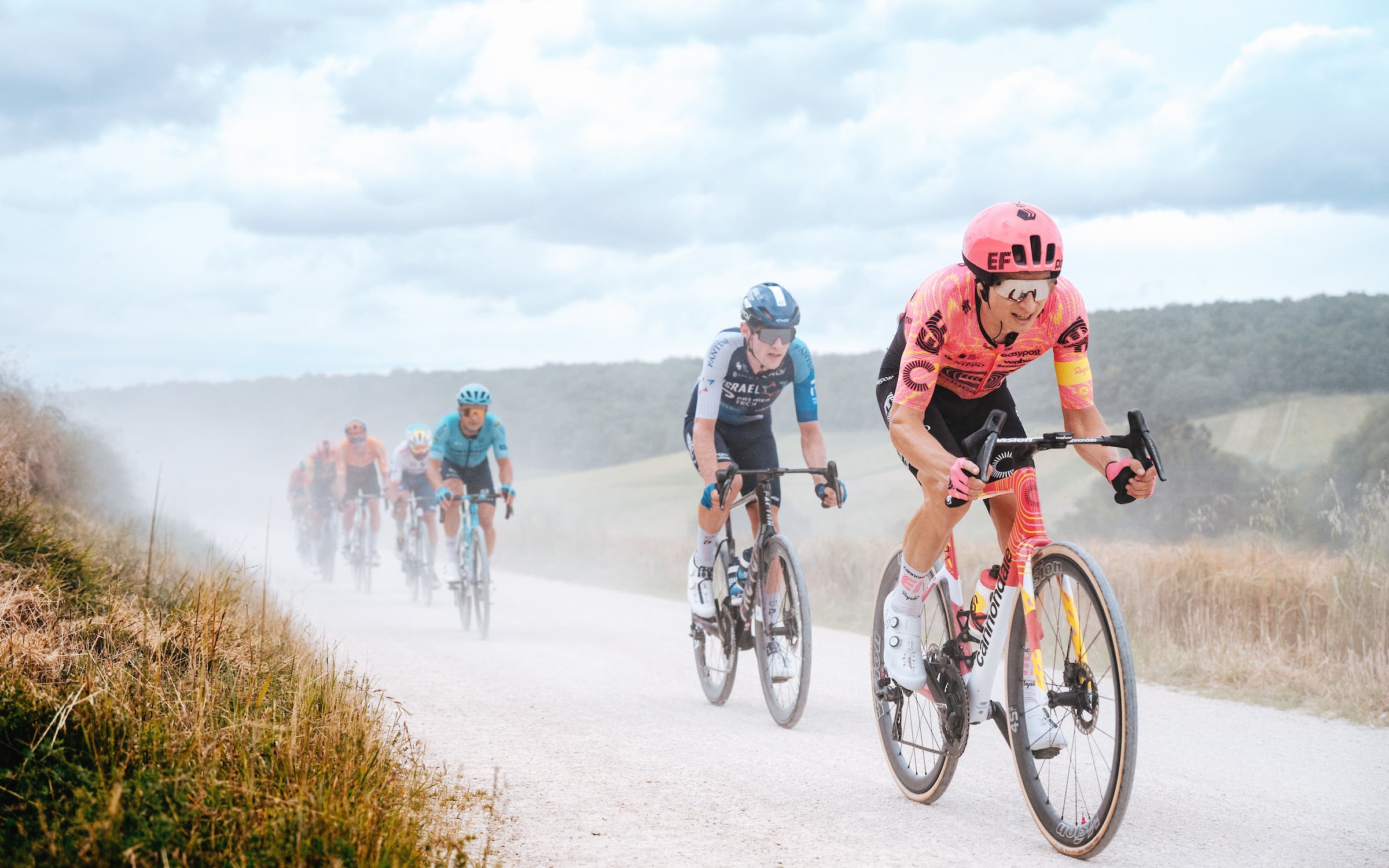 Neilson Powless leads a group through one of the sectors of gravel at the 2024 Tour de France. (Photo: Gruber Images)