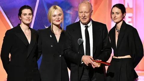Getty Images Inga Ibsdotter Lilleaas, Elle Fanning, Stellan Skarsgård, and Renate Reinsve accept Best Intergen/Foreign for "Sentimental Value" onstage during the 2026 Annual Movies for Grownups Awards with AARP at Beverly Wilshire, A Four Seasons Hotel on January 10, 2026 in Beverly Hills, California.