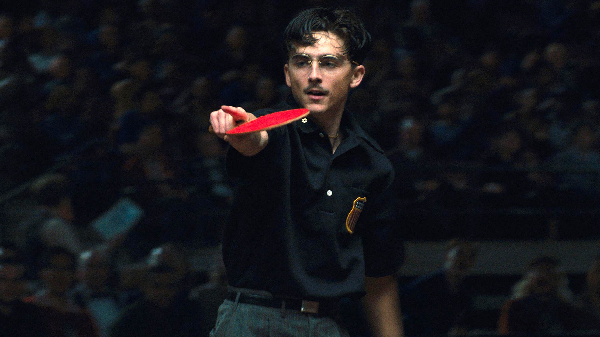 Marty Mauser (Timoth&eacute;e Chalamet) mid-match in a scene from "Marty Supreme"