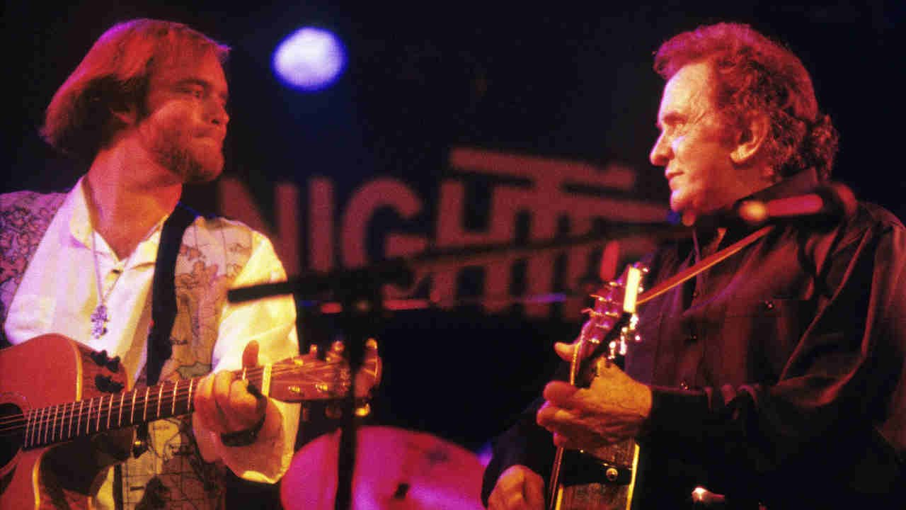 Johnny Cash performing with his son John Carter Cash in 1994