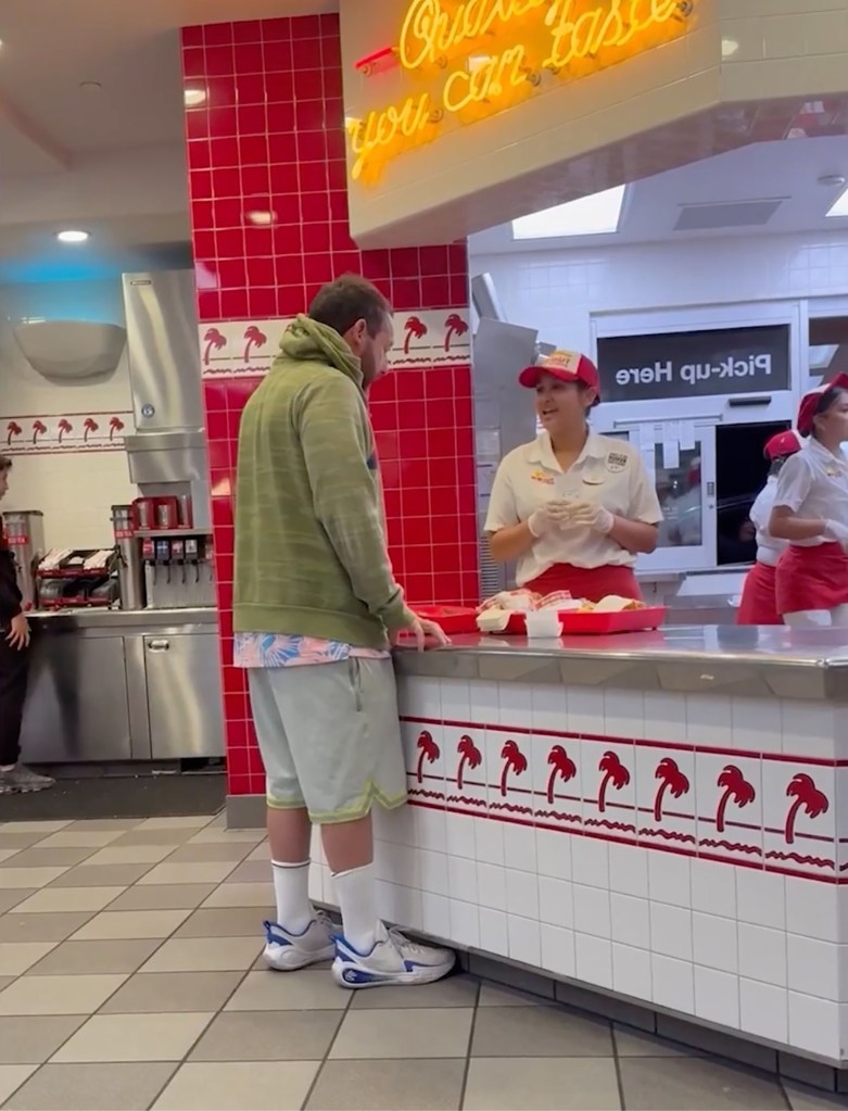 Adam Sandler ordering food at an In-N-Out fast food chain.