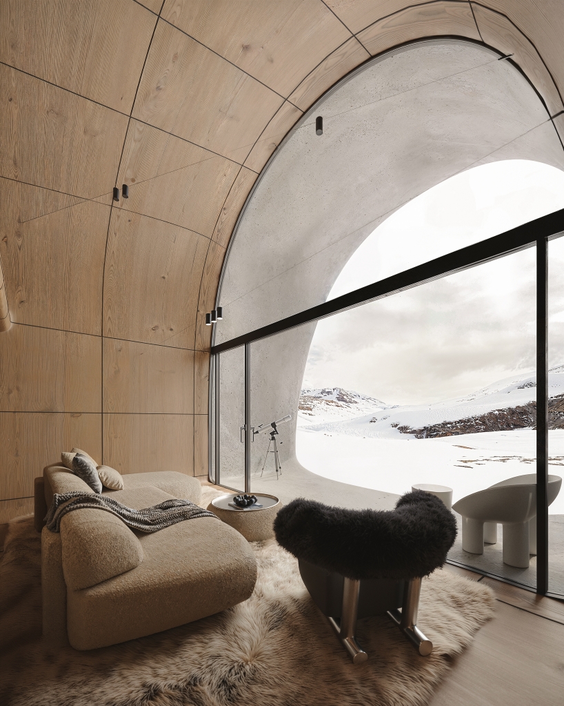 high-altitude cottage emerges like a rock from georgian mountains