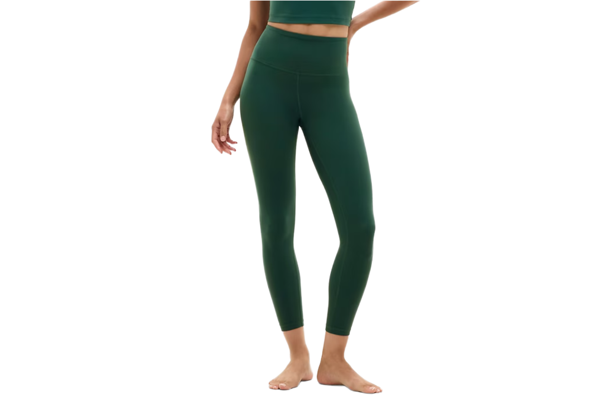 A person models dark green leggings and a matching crop top.
