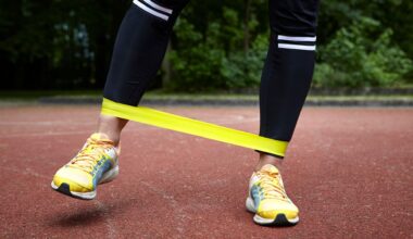 Woman doing crab walk exercise, stepping sideways with resistance band wrapped around trainers