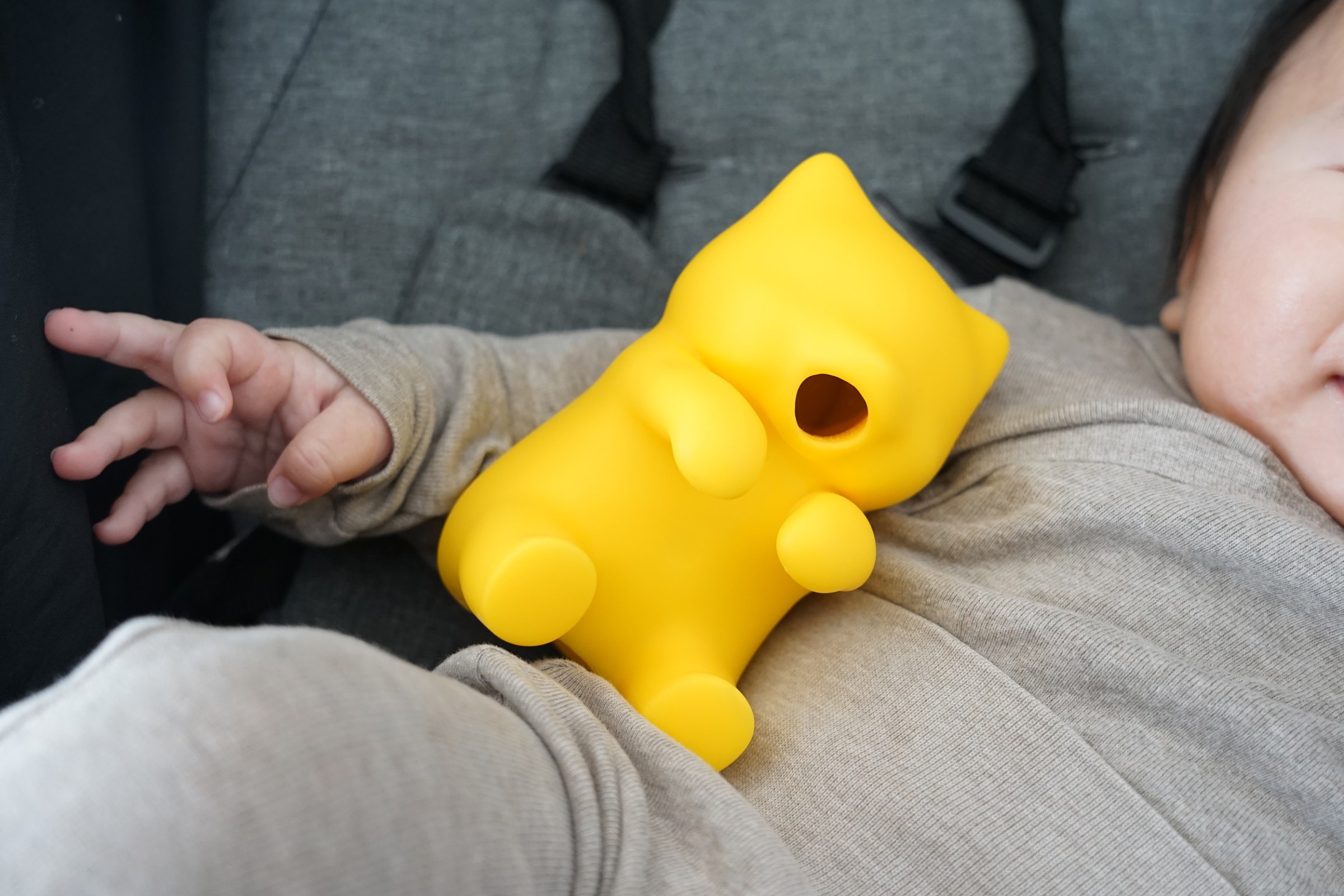 The Yukai Engineering Baby Fufu fan in yellow sitting on an infant.