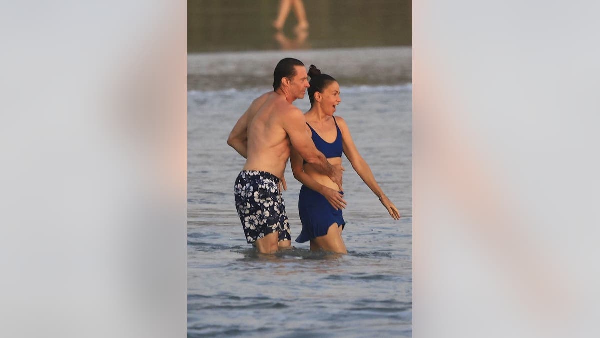 Hugh Jackman and Sutton Foster laugh