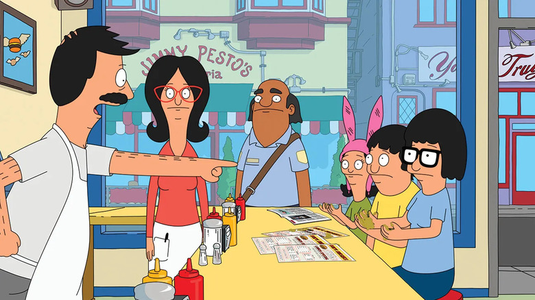 Bob Belcher points his finger at Louise, Gene, and Tina in "Bob's Burgers"