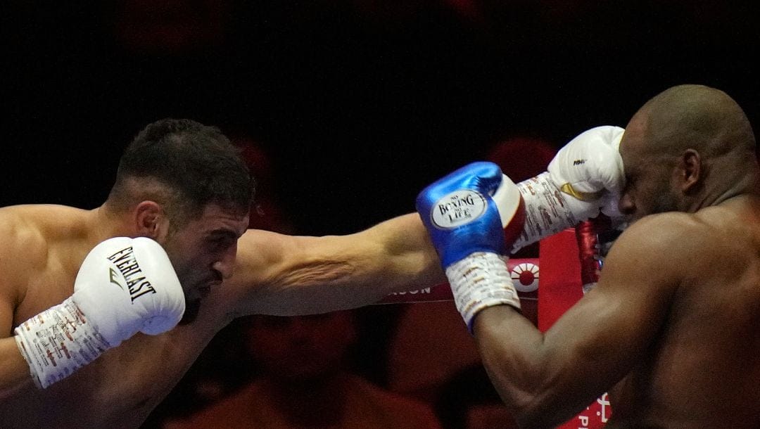 Germany's Agit Kabayel, left, lands a blow on Cuba's Frank Sanchez during their Heavyweight boxing fight, at the Kingdom Arena.