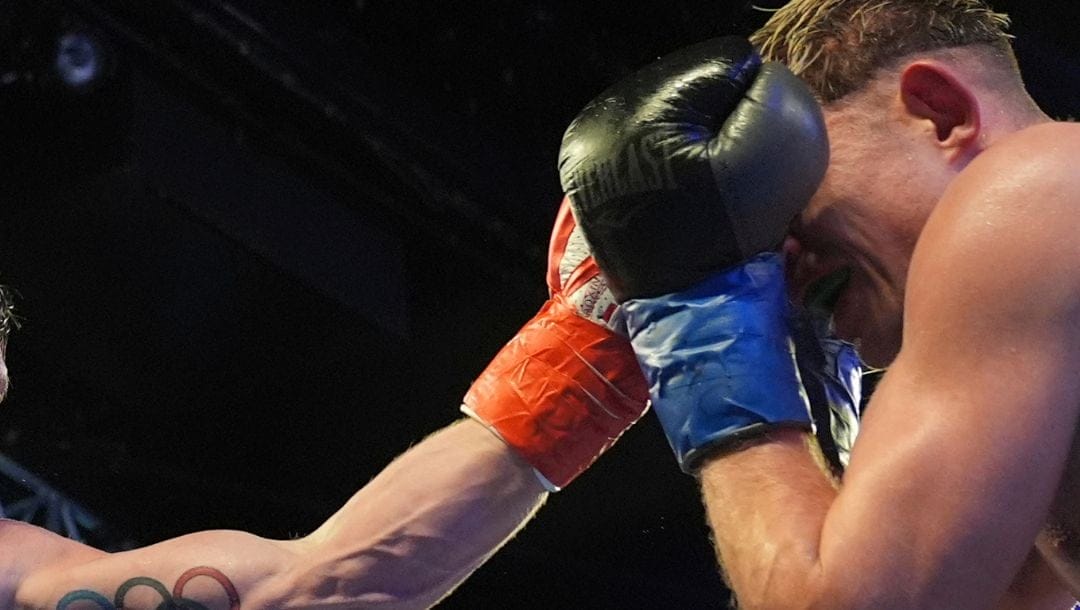 Ireland's Emmet Brennan, left, punches Ireland's Kevin Cronin during the fifth round of a super welterweight boxing match.