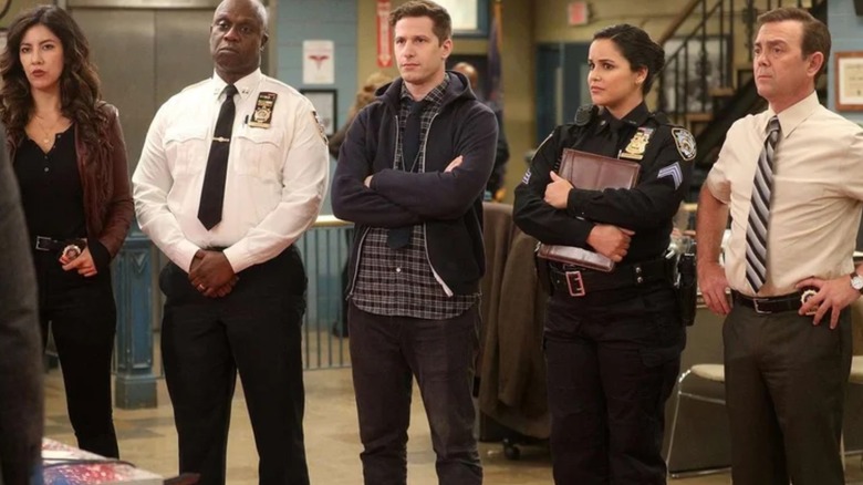Rosa (Stephanie Beatriz), Holt (Andre Braugher), Jake (Andy Samberg),  Amy (Melissa Fumero) and Charles (Joe Lo Truglio)