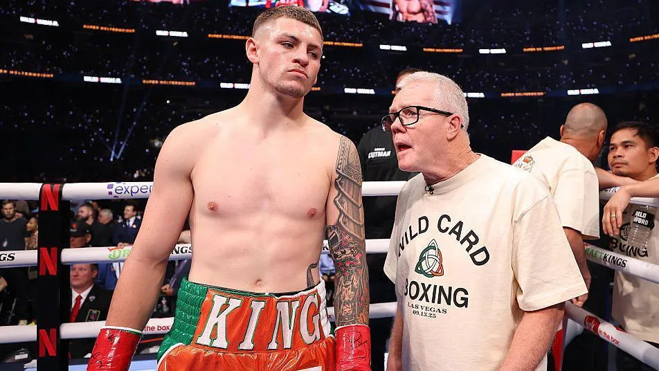 Callum Walsh in the ring with his coach Freddie Roach beside him
