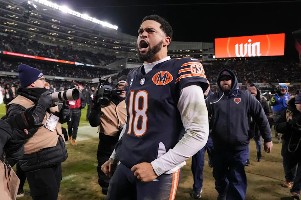 Caleb Williams celebrates after the Bears knocked off the Packers in a wild-card playoff game. (Photo by Todd Rosenberg/Getty Images)