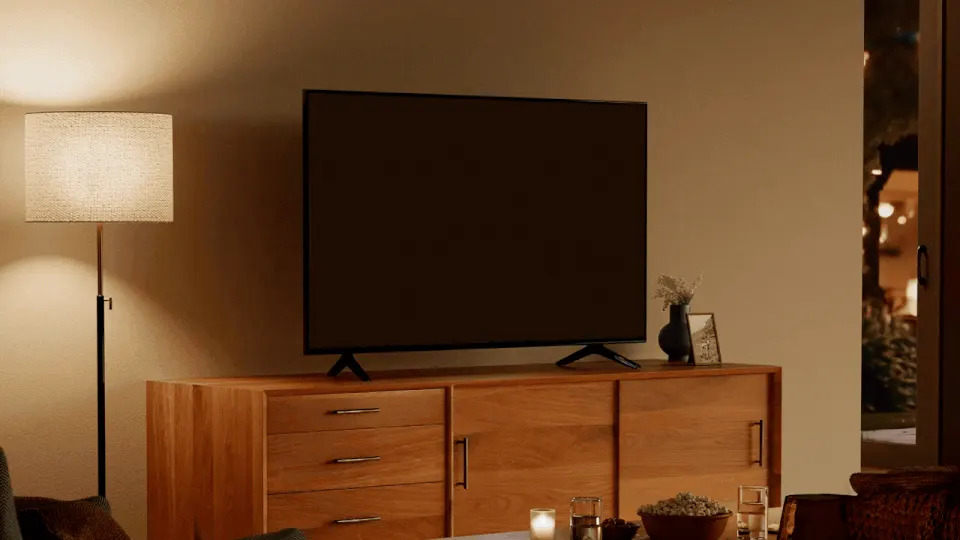 an amazon fire tv playing while resting on a media console