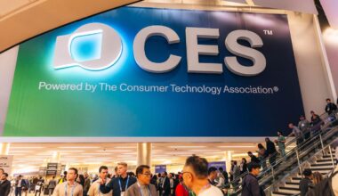 A large CES banner above a room full of people and an escalator.