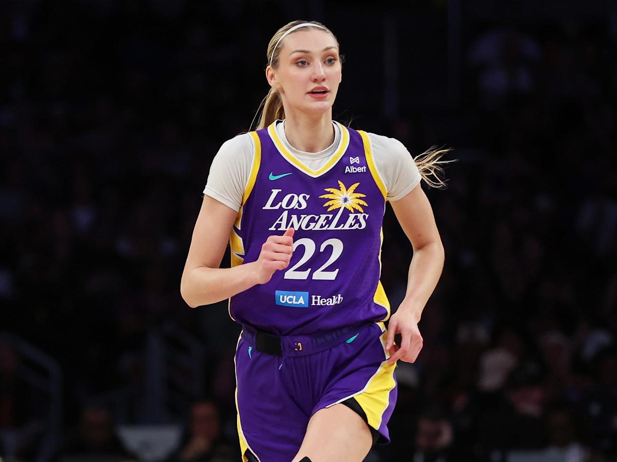 Los Angeles Sparks player Cameron Brink in a purple 22 jersey runs across the court in a WNBA game