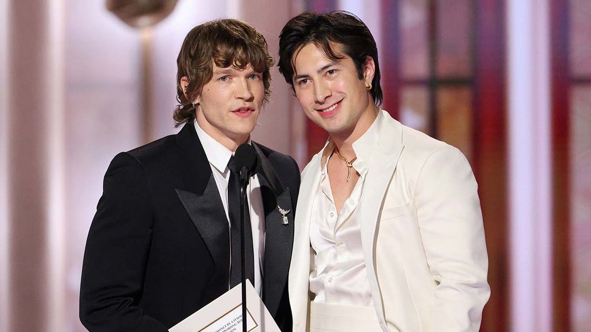 Connor Storrie and Hudson Williams speak onstage