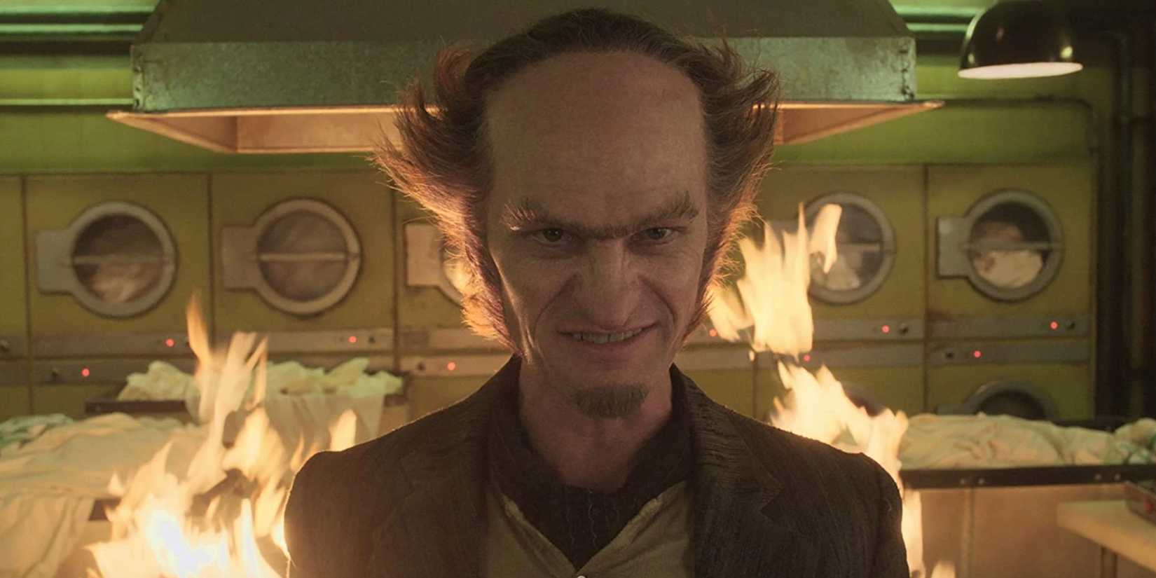 Count Olaf in front of flames in a laundromat in A Series Of Unfortunate Events