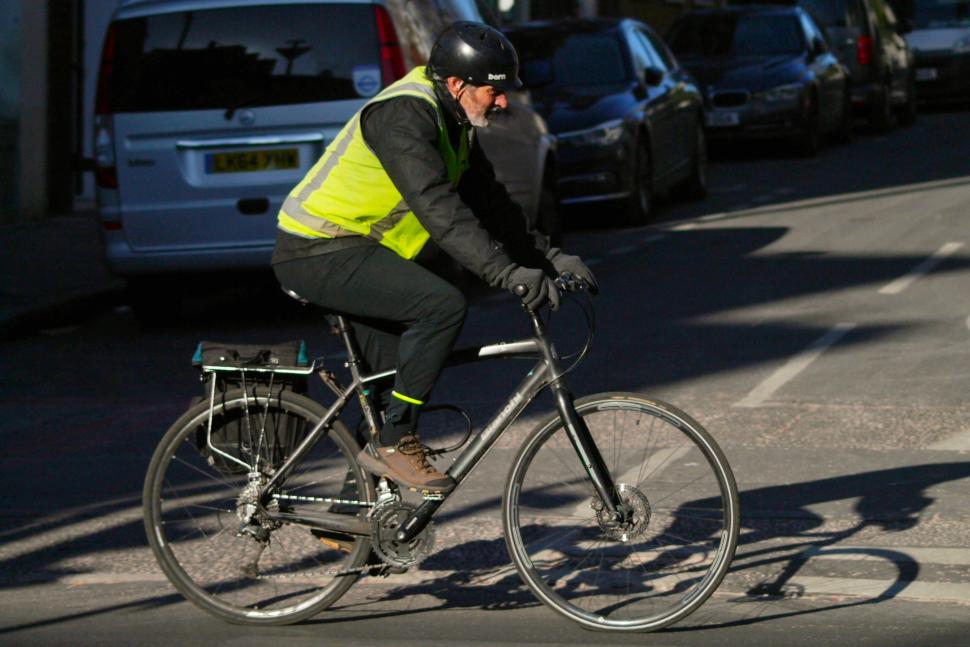 Cyclist in London bianchi and high-vis Cyclist in London bianchi and high-vis