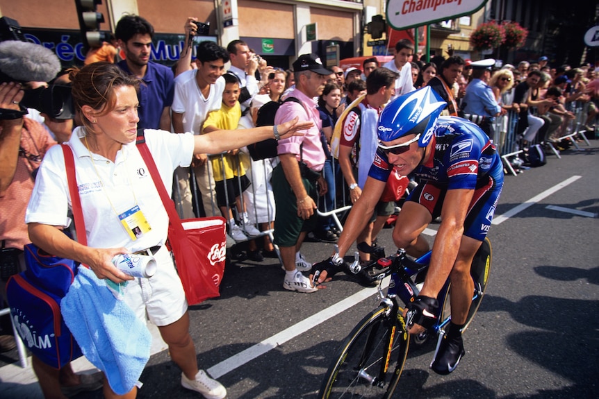 Emma O'Reilly stands next to Lance Armstrong