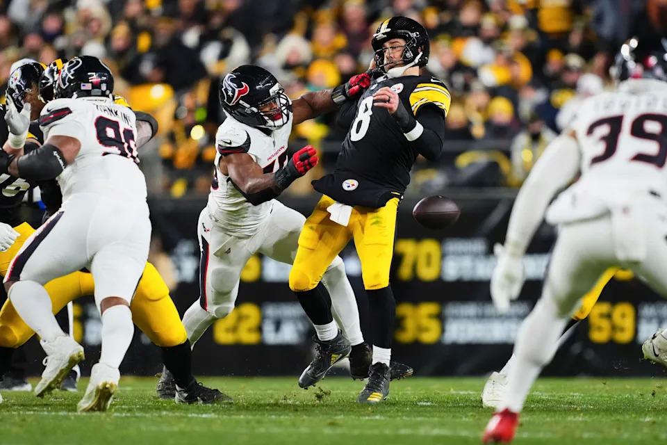 PITTSBURGH, PA - JANUARY 12: Aaron Rodgers #8 of the Pittsburgh Steelers fumbles the ball against the Houston Texans during the second half of an AFC Wild Card Playoff game at Acrisure Stadium on January 12, 2026 in Pittsburgh, Pennsylvania. (Photo by Cooper Neill/Getty Images)
