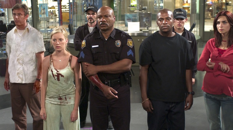 Ving Rhames, Mekhi Phifer, Sarah Polley, Michael Kelly, Inna Korobkina, Jake Weber, and Kevin Zegers stand together in 