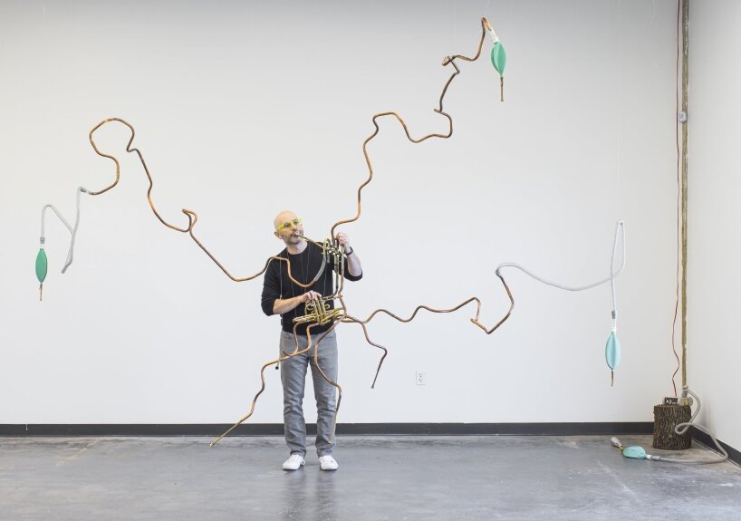 there’s even a plant-like instrument made from salvaged brass, medical breathing bags, and sheng reeds