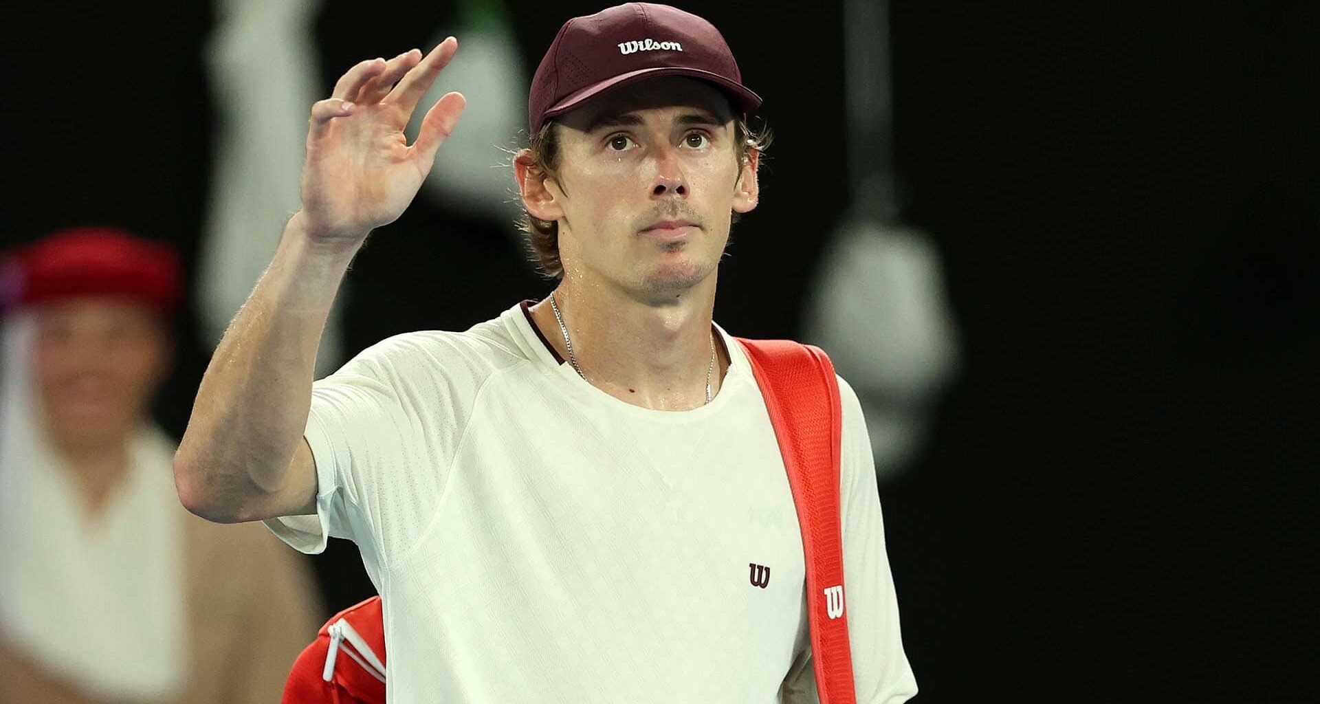 Alex de Minaur waves goodbye to the Melbourne crowd on Tuesday night.