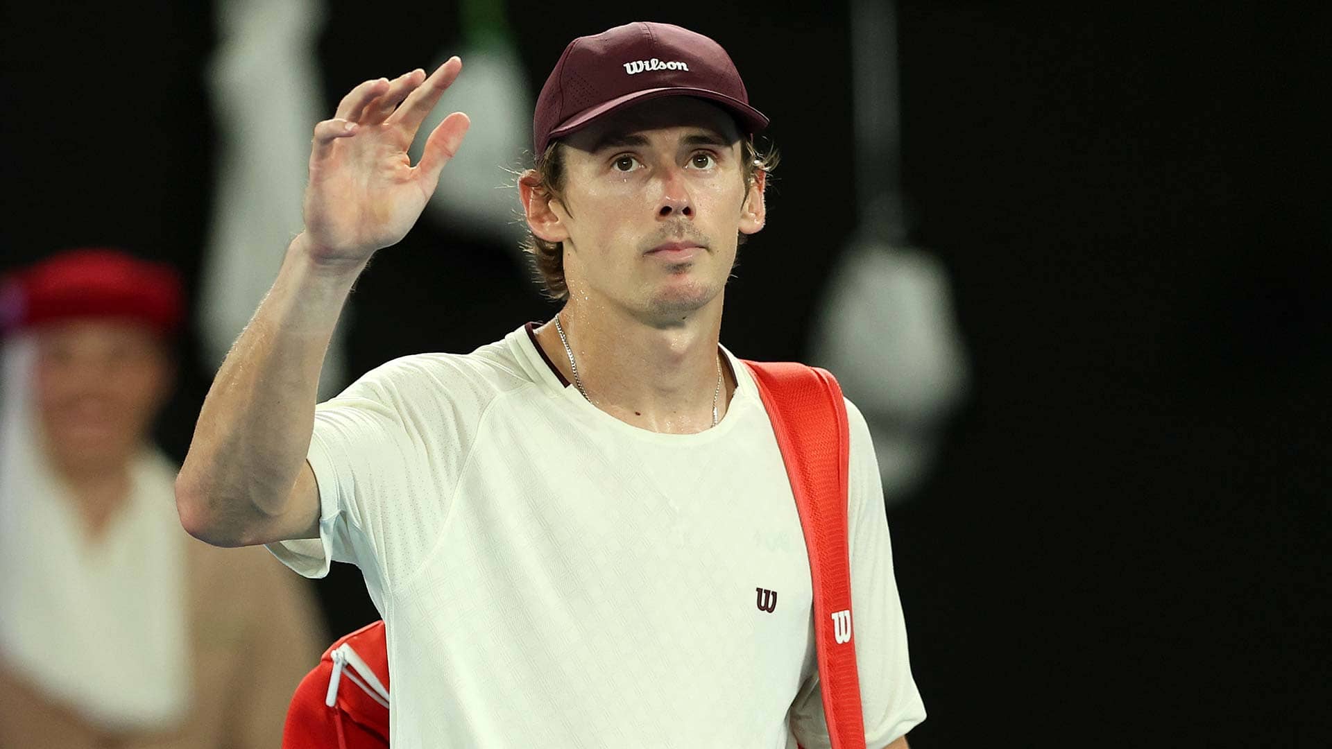 Alex de Minaur waves goodbye to the Melbourne crowd on Tuesday night.