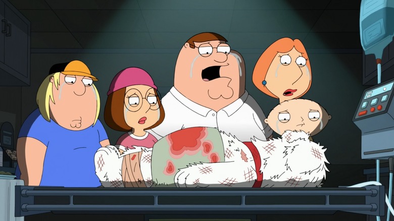 Family standing around Brian's body in Family Guy