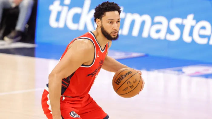 Ben Simmons dribbles the ball.