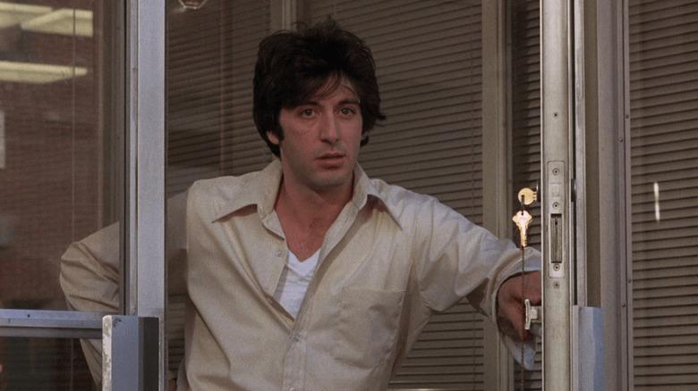 Sonny Wortzik (Al Pacino) keeping a door ajar in Dog Day Afternoon