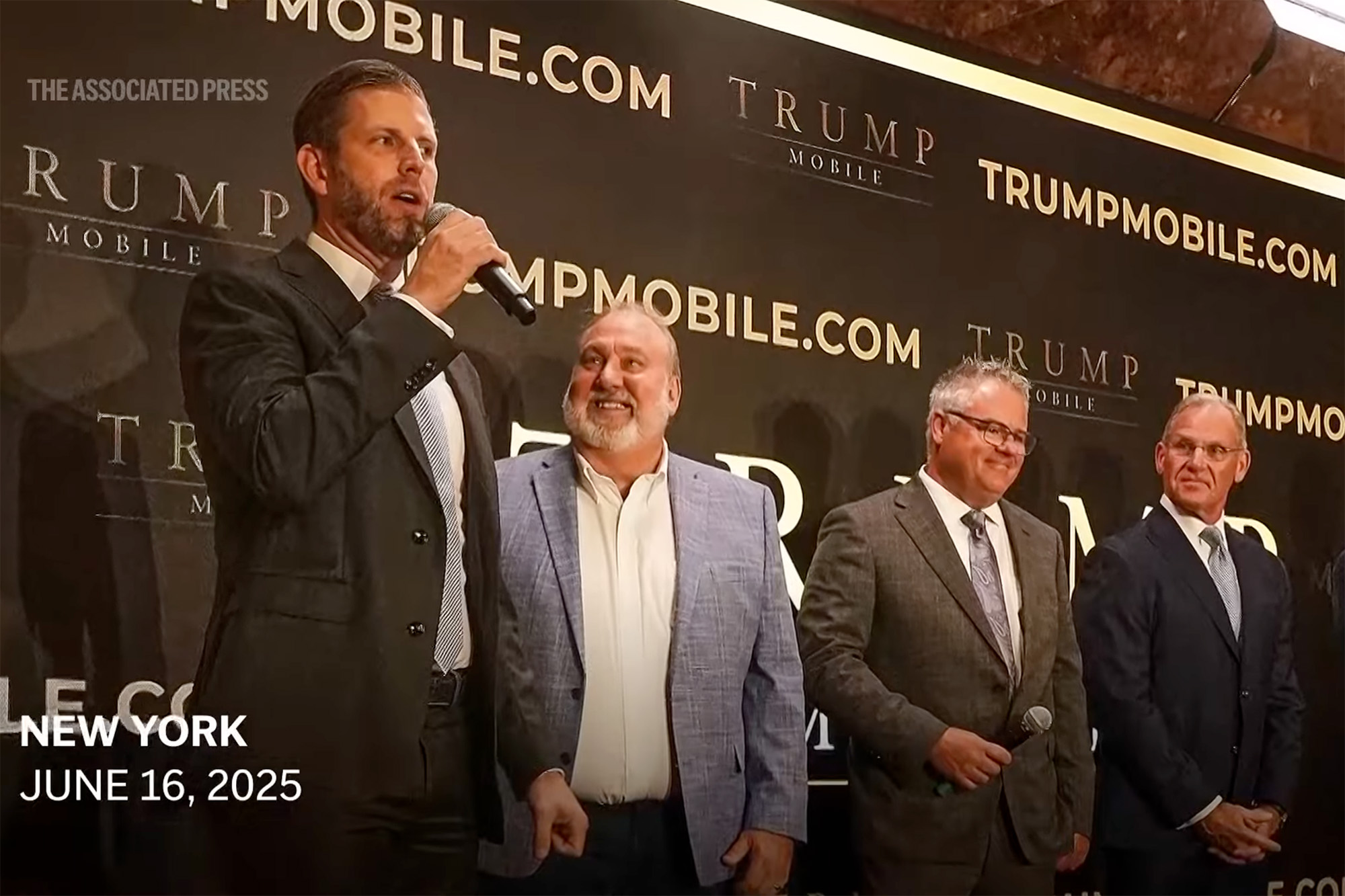 A photo of Eric Trump, Don Hendrickson, Eric Thomas, and Pat O’Brien in front of a Trump Mobile sign