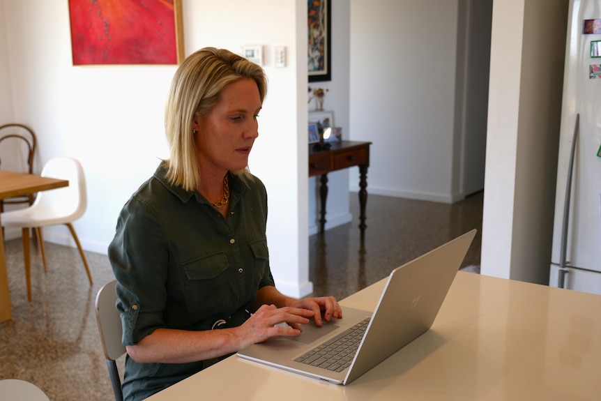 Kate Day working on her laptop