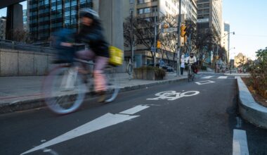 A cyclist rides in a bike lane on University Avenue in Toronto, highlighting the court case about bike lane removal.