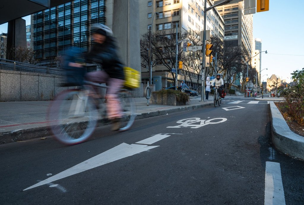 A cyclist rides in a bike lane on University Avenue in Toronto, highlighting the court case about bike lane removal.