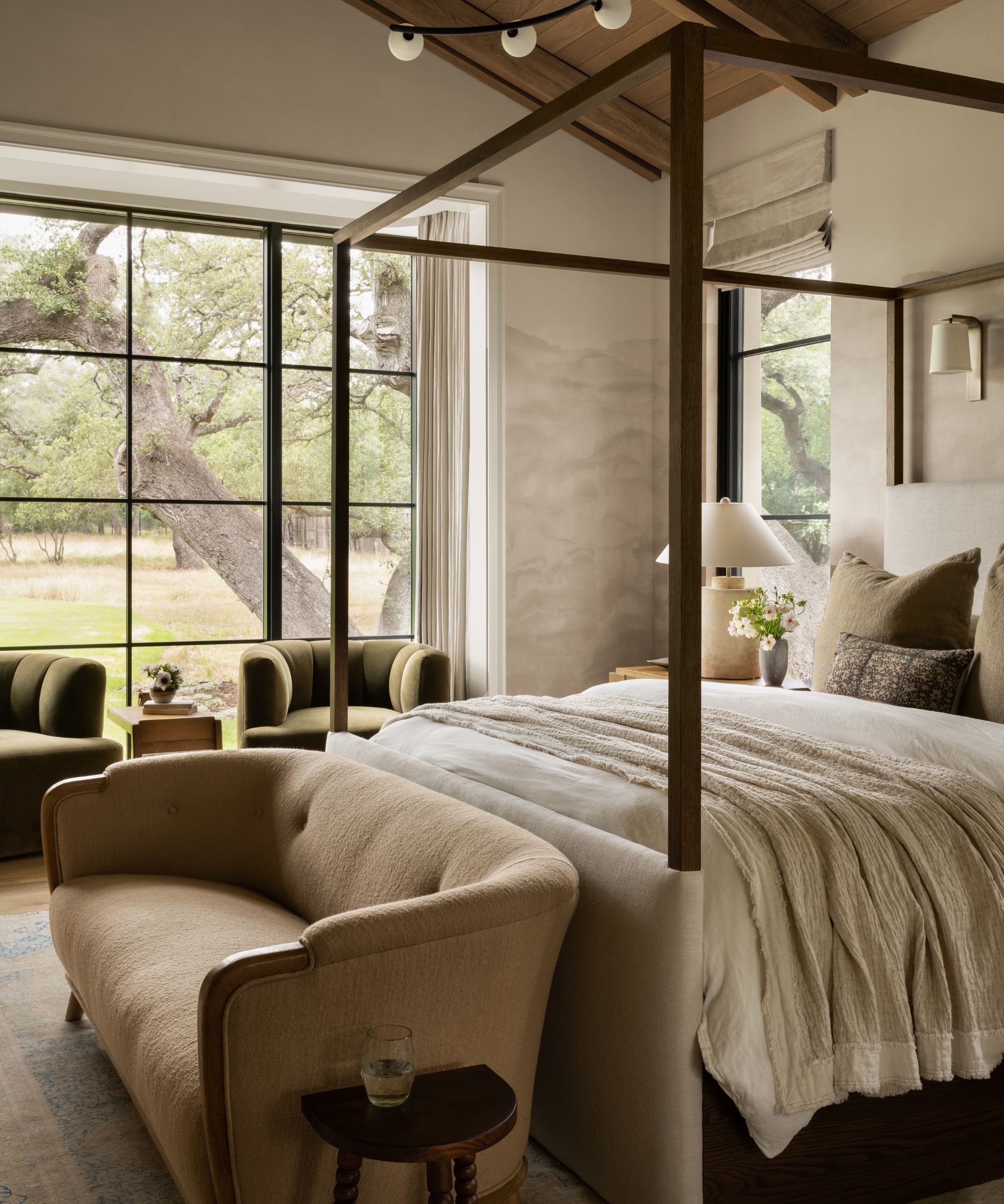 the serene modern rustic primary bedroom of Studio McGee's The Oaks house tour