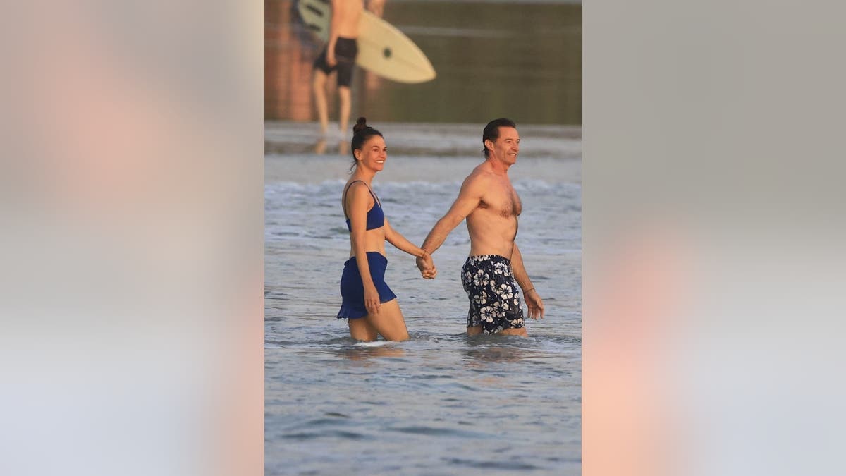 Sutton Foster and Hugh Jackman hold hands