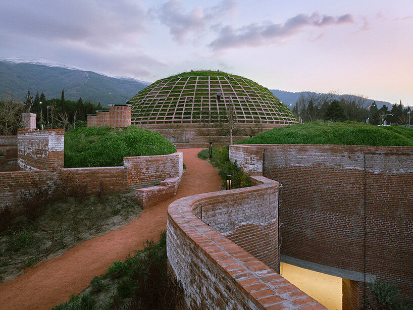 earth-covered domes and brick vaults shape liberation museum of manisa in turkey