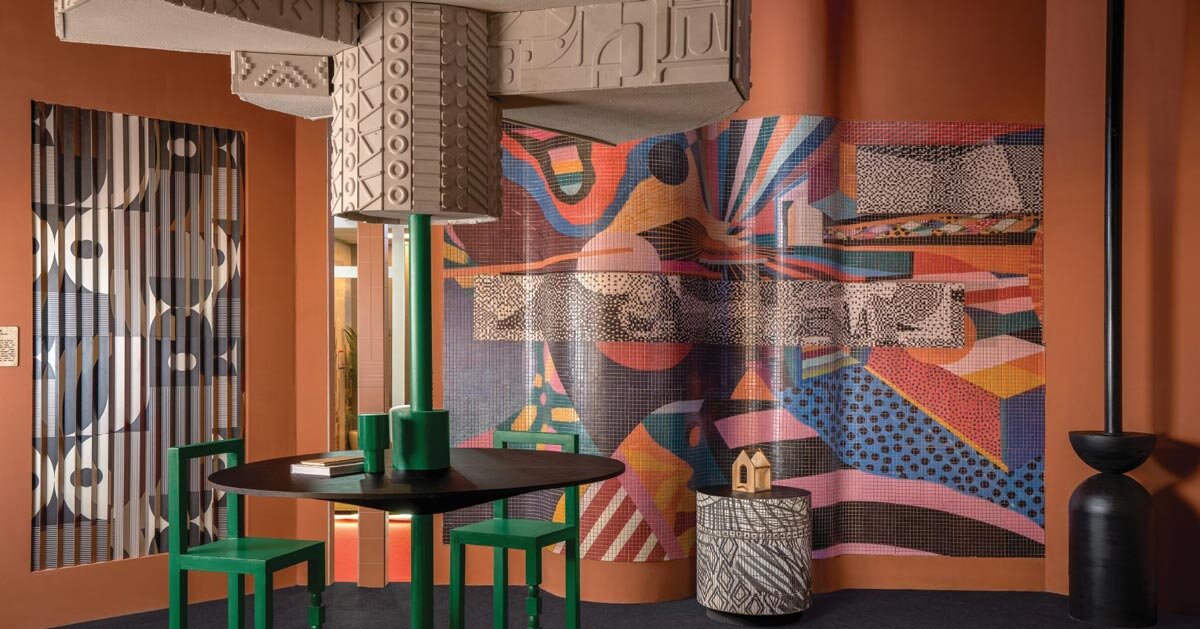 patterned tiles extend from curved walls to furniture in layered retail exhibition booth